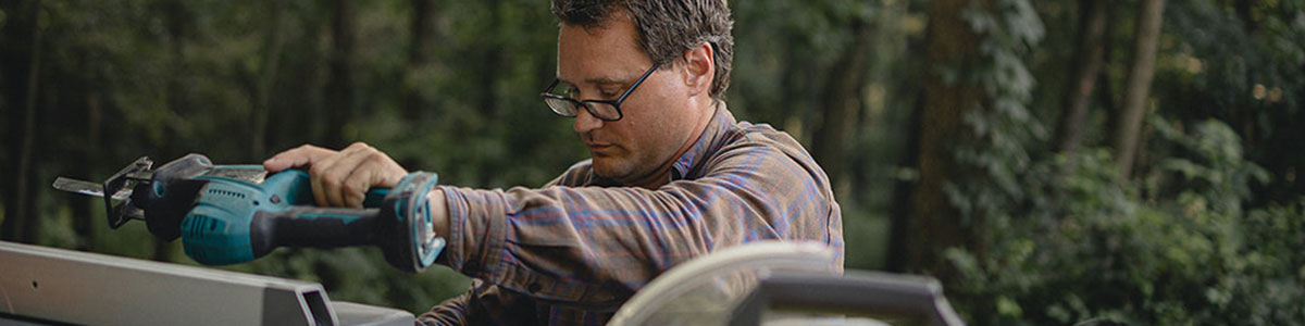 Man Using Carpentry Equipment